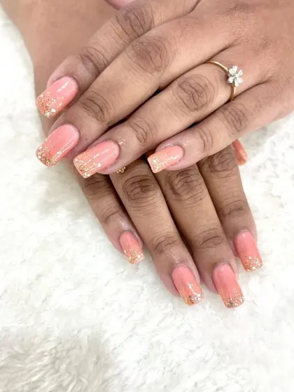 A full view of the subtle peach and gold glitter bridal nails, a perfect choice for understated glamour.