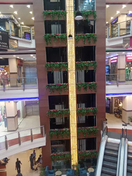 Another view of the mall elevator project, showing the hanging baskets from a different level.
