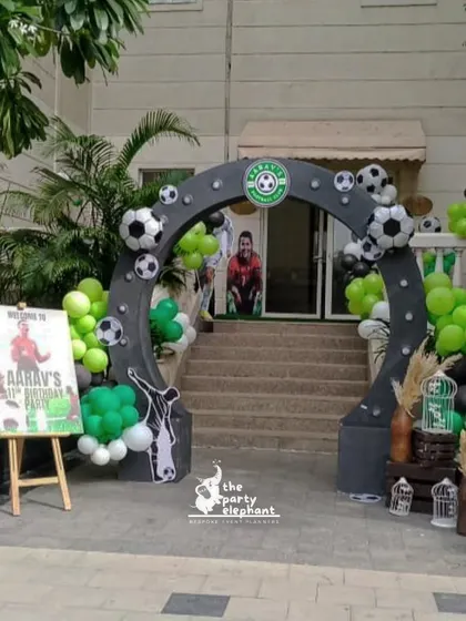 I create custom entrances for every theme. This football party entrance featured a large arch decorated with soccer balls and a silhouette of a player, making guests feel like they were entering a stadium.