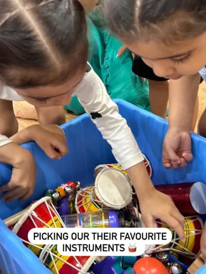The excitement is visible as these children dive into our box of instruments. Giving them the chance to choose their favorite instrument for the day empowers them and makes the experience personal and fun.
