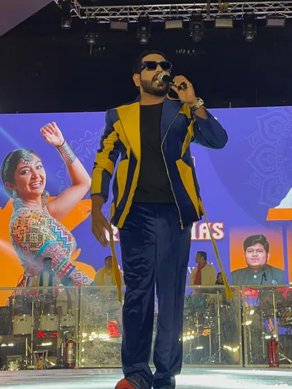 Another angle from the Rangraas stage. As a festival MC, I am the central point of energy, guiding the audience through the night's performances.