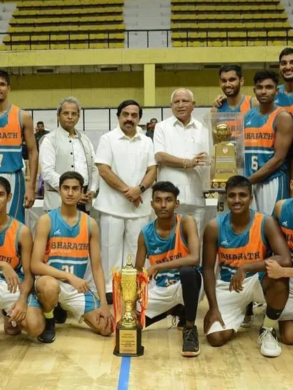 The team with officials and the championship trophy.