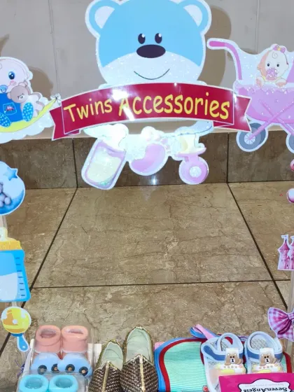 A close-up of the 'Twins Accessories' banner and the cute decorations I use for the twin hampers.