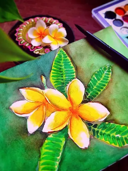 This watercolor piece captures the soft, fragrant Plumeria flowers. I used wet-on-wet techniques for the background and careful layering to create the subtle gradient on the yellow and white petals.
