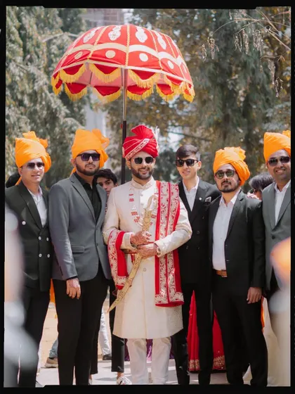 The groom posing with his groomsmen during the 'Baraat'.