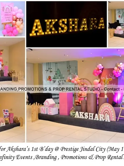 A dreamy boho theme for Akshara's first birthday. This setup features a beautiful arrangement of pink and earthy tones, with pampas grass, rainbow props, and themed cylinder tables.