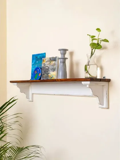 A simple and elegant corbel shelf, providing a perfect spot for displaying small decor items or photos.