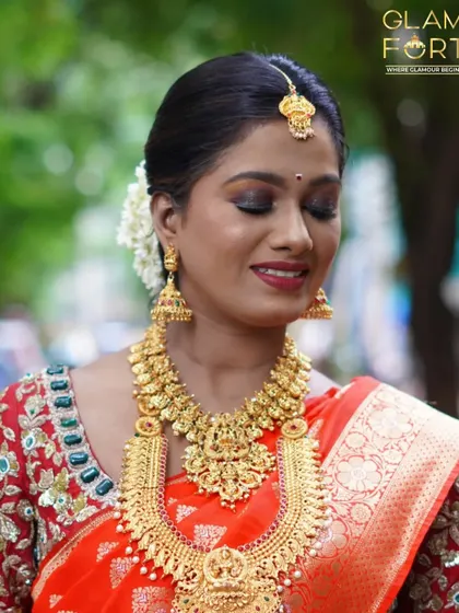 A close up of the eye makeup for a South Indian bride. I used warm, earthy tones with a touch of gold shimmer to make her eyes stand out, paired with a classic red lip.
