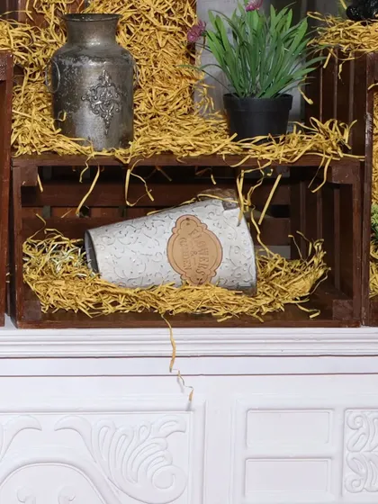 We use decorative crates, vintage-style vases, and hay to create a rustic, farmhouse-chic vibe for this food counter's decor.