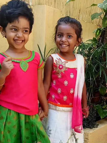 Another picture of two smiling friends in their festive clothes for Ugadi.
