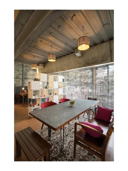 A large conference table designed for our studio's gallery space. The piece features a raw, form finished concrete top set on minimalist steel legs, showcasing our work with industrial materials for commercial and office environments.