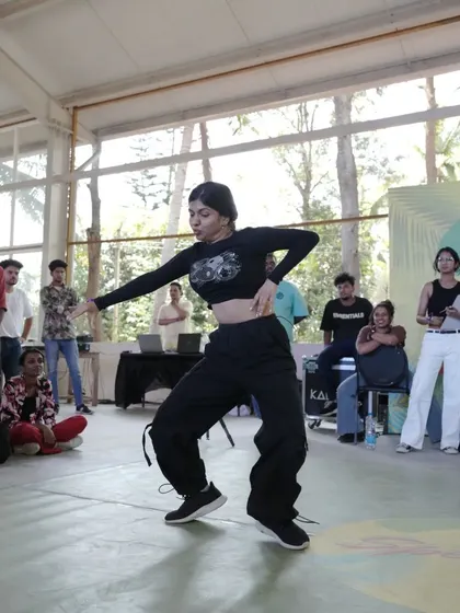 A dancer in the middle of a battle at Spectra, showcasing their skills.