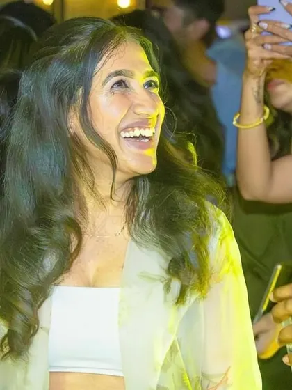 A guest laughing and enjoying the party.