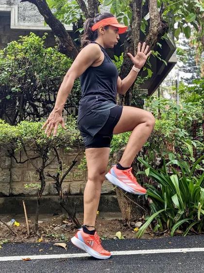 Performing running drills in my Adizero SLs. They are lightweight and responsive, making them great for speed work and form drills.
