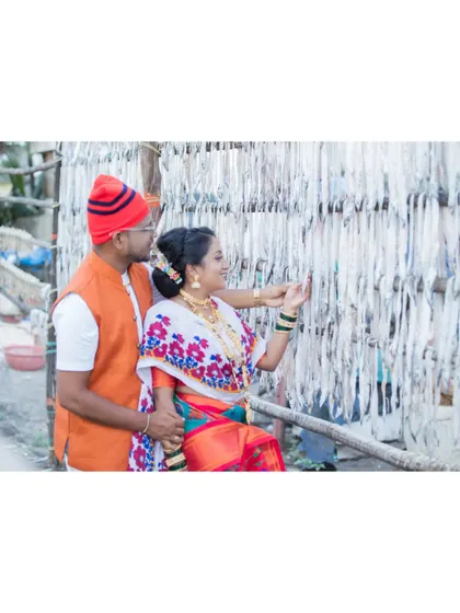 The couple explores the local fish market setting, adding an authentic and interesting element to their culturally-themed pre-wedding photos.