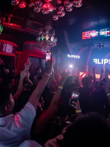 Hands in the air at a club in Dubai. The energy is universal, no matter where in the world I play.