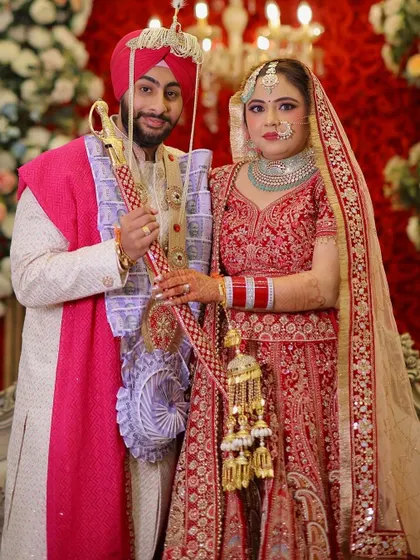 My bride Mansi with her groom. A classic portrait against a beautiful floral backdrop.