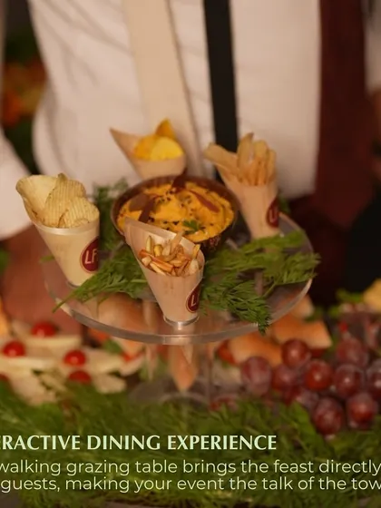 A close-up of the top tier of our floating grazing table, featuring cones of chips and fries. This interactive dining experience brings the feast directly to your guests, making your event the talk of the town.