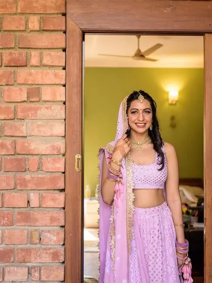 A happy portrait of the bride, ready to go for her intimate home wedding.