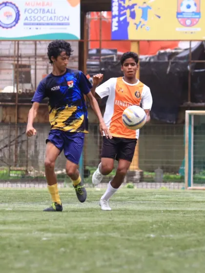 A TFA player on the ball, looking to break through the defense.