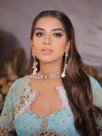 A powerful and confident portrait. The makeup is bold and modern, perfect for making a statement.