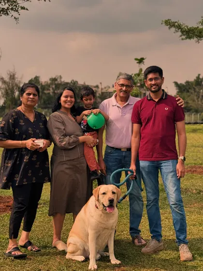 A beautiful multi-generational family portrait with their beloved Labrador. The Pawsome Camp is for everyone.