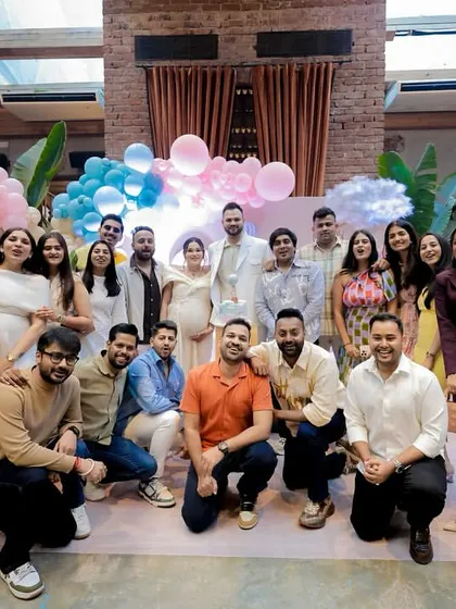 A group photo of the happy couple with their friends and family, celebrating this wonderful new chapter.