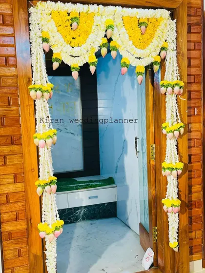 A duplicate of image 82, showcasing the traditional door hanging made with jasmine and mango leaves.