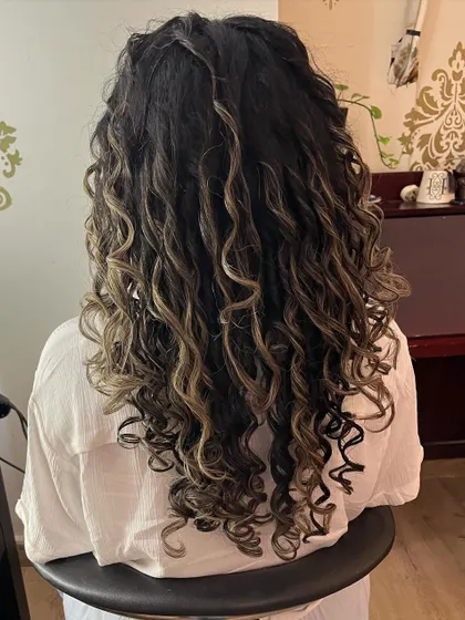 The back view shows the length and beautiful spiral curls.