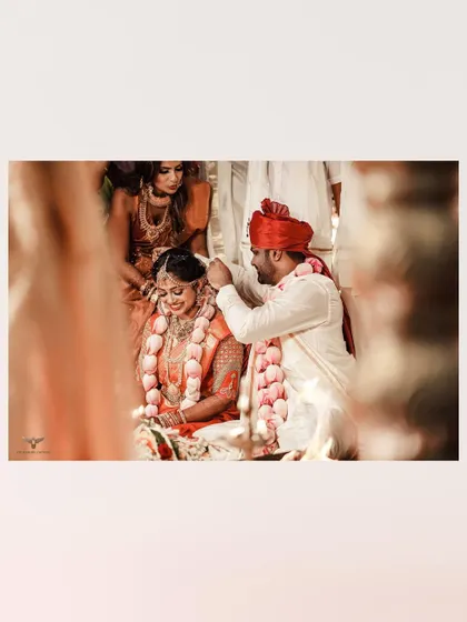 A key moment in a South Indian wedding. The groom applies kumkum to the bride's forehead, a solemn and significant ritual that we captured with reverence.
