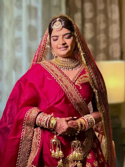 A serene shot of the bride, her eyes closed to showcase the beautiful eye makeup.