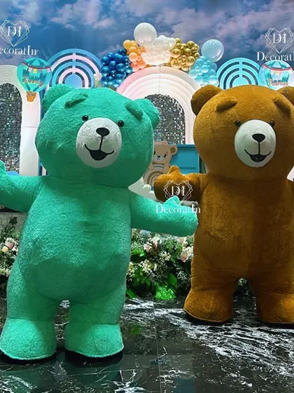 Life-sized teddy bear mascots in teal and brown, ready to bring fun and excitement to the party.