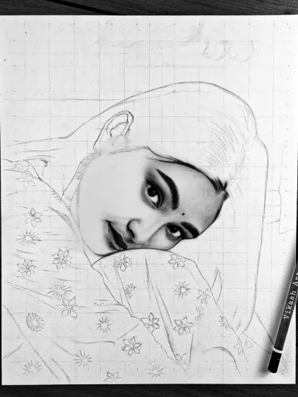 A work-in-progress shot of a portrait from Gujarat, with the face fully shaded and ready for the hair and clothing.