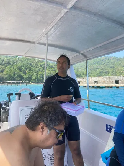 Moments from our Andaman dive trips, showing everything from gearing up at the dive center to relaxing on the boat between dives.