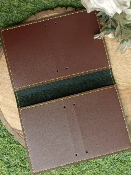 This image shows the inside of the passport cover, with slots to securely hold the passport in place. The stitching is neat and durable, ensuring quality.