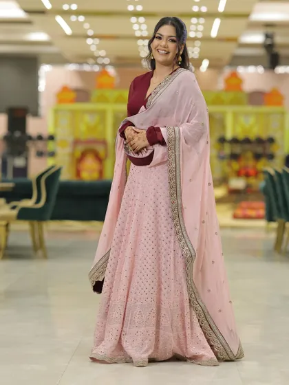 A full-length portrait showcasing the complete roka ceremony look. The color combination is a modern alternative to traditional reds.