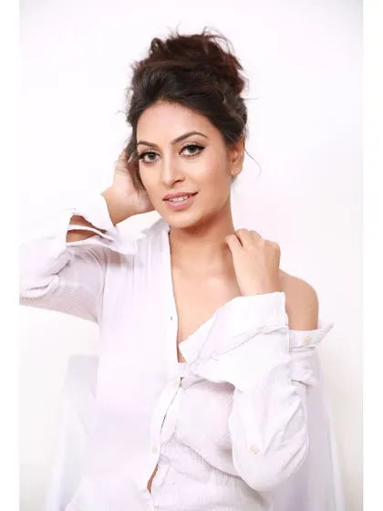 A classic headshot pose, with the model looking directly at the camera, conveying confidence and approachability.