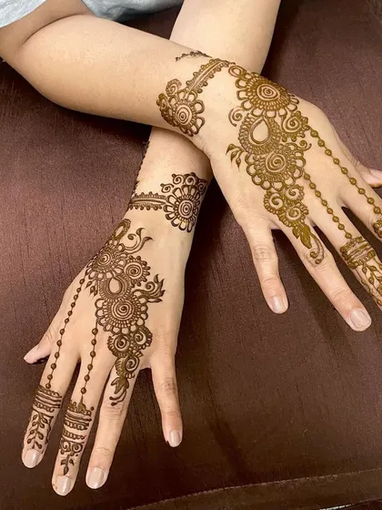 The same delicate and graceful design as seen in a previous video, now as a still image. The beaded chains and simple cuff are perfect for an understated look.