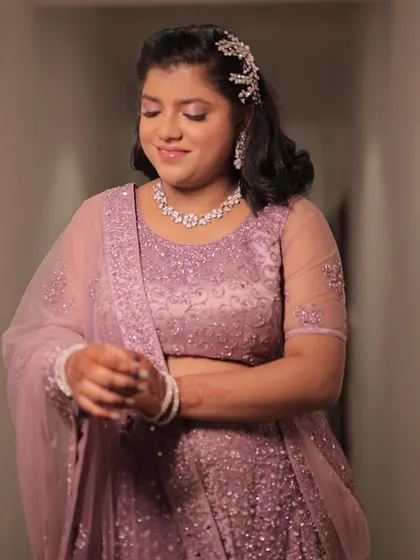 Glammed up for her sister's wedding. I understand that the sider's makeup is just as important, and it was a joy to create this radiant look with stunning eyes and a complementary hairstyle for her.
