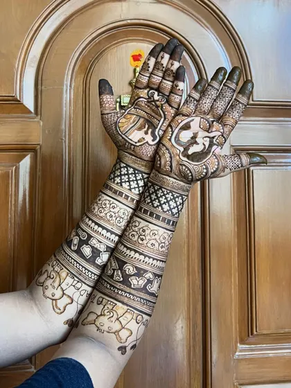 Another angle of the baby shower design, showing the teddy bear and other cute motifs on the forearms.