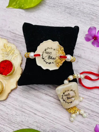 The complete bhaiya-bhabhi rakhi set, displayed together. These are handcrafted with a marble-effect resin.