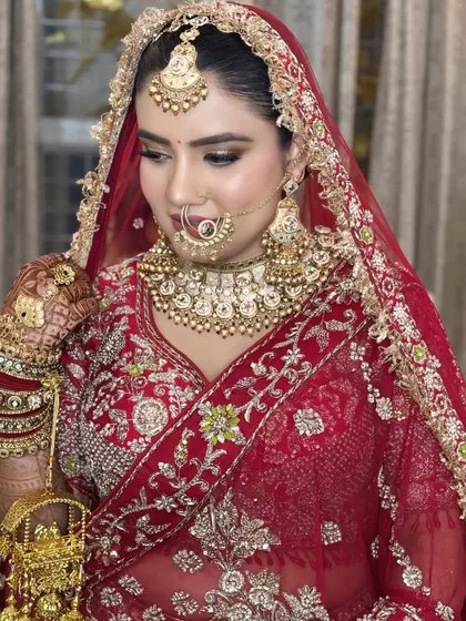 A beautiful three-quarter profile shot, showing off the contour and highlight, as well as the intricate details of her jewelry.