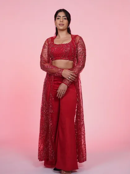 Another view of the red three-piece set, showing off its vibrant color and sparkling details.
