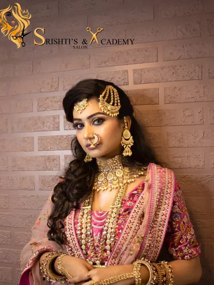 A radiant and regal Muslim bridal look, perfect for a Nikkah or engagement ceremony. The pink and gold ensemble is paired with glamorous makeup and a traditional passa.