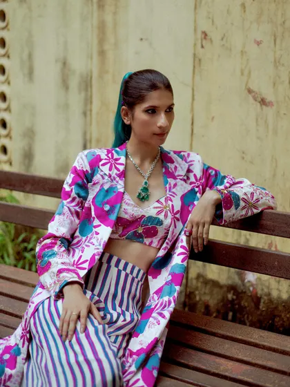 A closer look at the styling for this festive lookbook, featuring a mix of bold prints and statement jewelry.