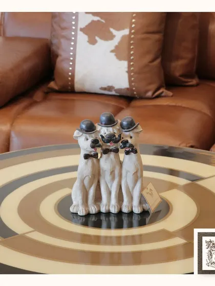 This dapper set of three dogs, complete with bowler hats and bow ties, adds a touch of country-style charm and humor to a coffee table. They are sure to make you and your guests smile.
