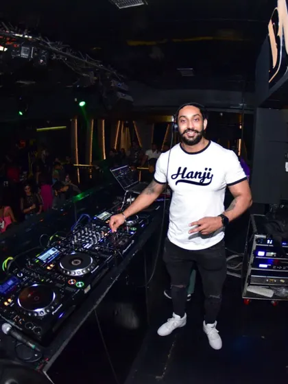 Rocking a "Hanji" t-shirt at the console. My Punjabi roots are a big part of my musical identity, and I love dropping Bhangra bangers.