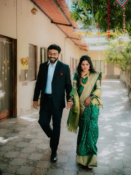 A candid walking shot of the couple at their engagement venue.
