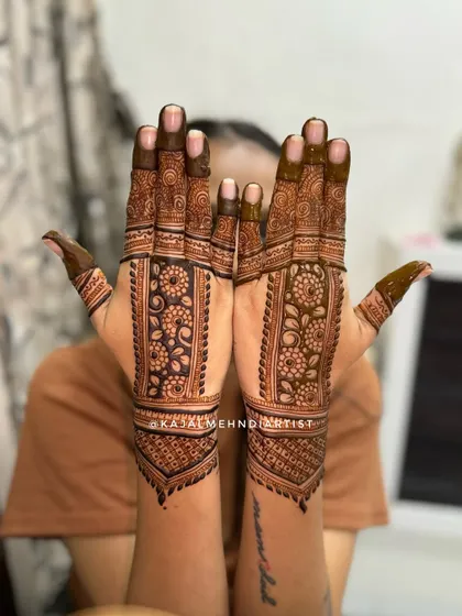 A beautiful backhand design with floral bands. This is a great option for guests, as it's detailed and elegant without being as heavy as a full bridal design.