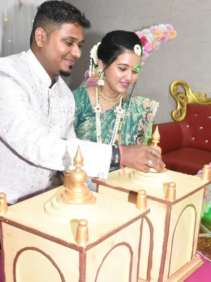 A close-up of the couple participating in the gender reveal ritual with our custom-designed temple boxes.